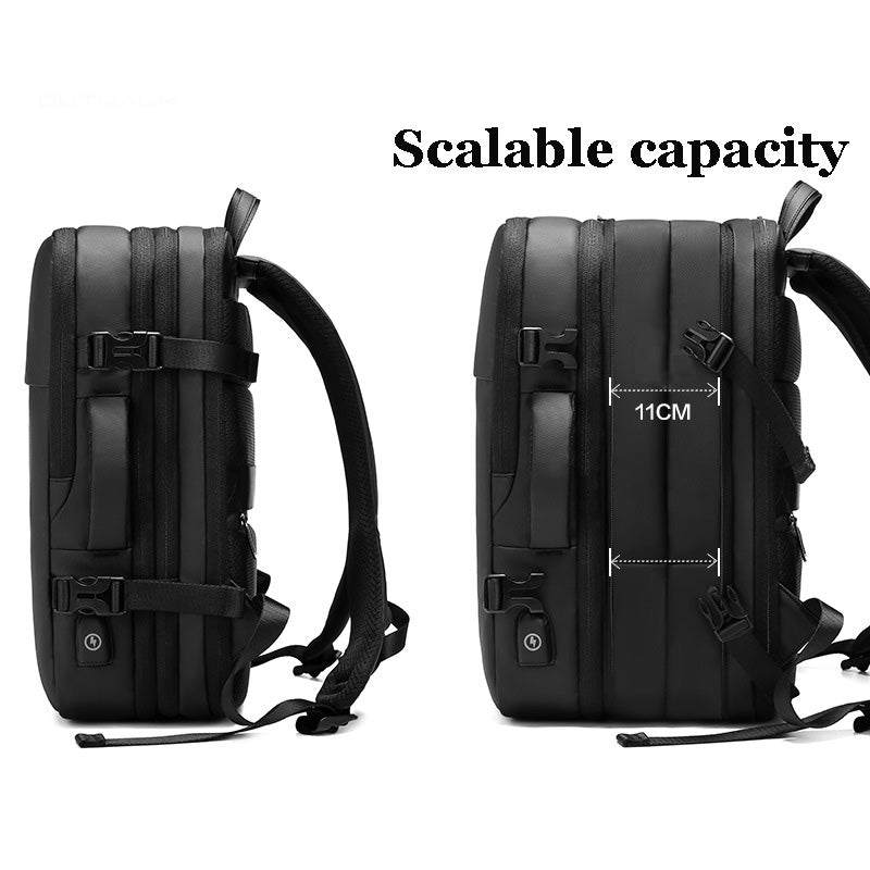 Computer Backpack in black Oxford material with expandable capacity, zipper closures, side handle, and adjustable straps.