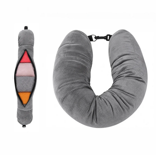 Airplane pillow in soft grey fabric with a U shape and a zippered pocket for storage, featuring a clip closure.