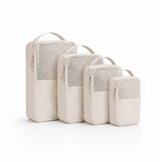 Organizer-Set of four beige fabric travel pouches with mesh panels and top handles, varying sizes for versatile storage.