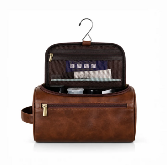Travel toiletry bag in brown faux leather with multiple compartments, a hook, and a zippered mesh pocket for organization.